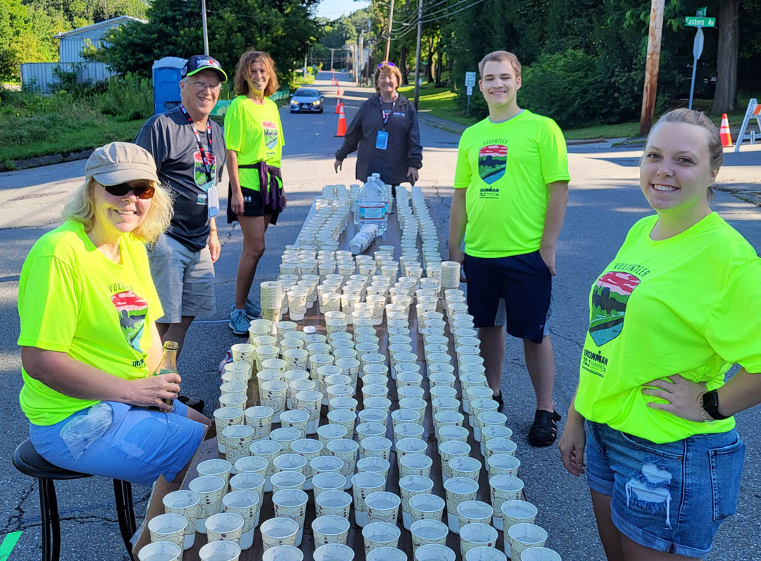 KSB's Gail, Mary, and Emily volunteering at the YMCA Ironman triathlon