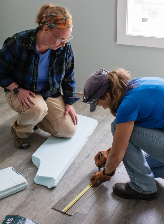 KSB's Heather M. cutting flooring for a new home