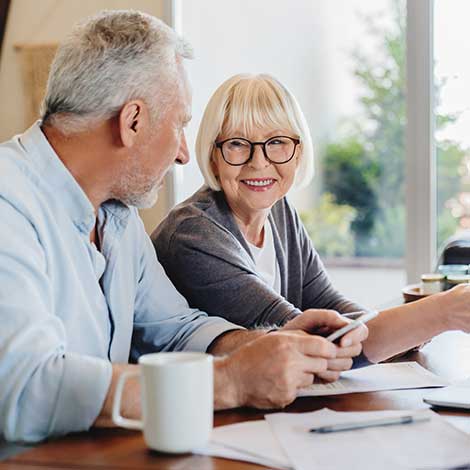 Mature couple with paperwork.